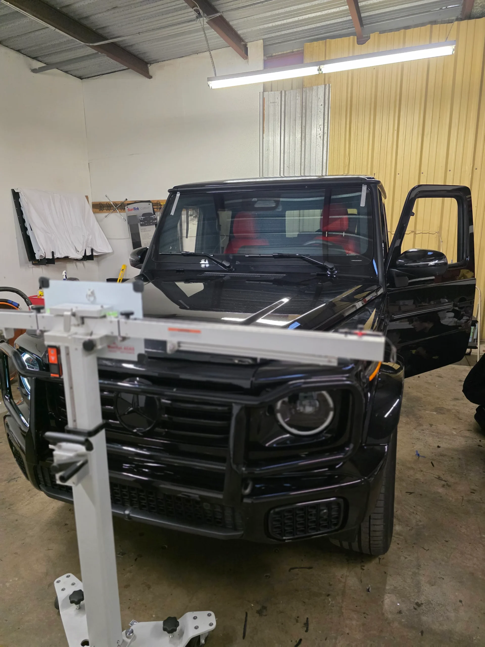ADAS calibration equipment set up in front of a Mercedes G-Wagon at A Star Auto Glass shop in Sarasota FL
